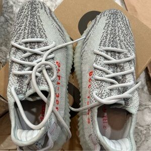 Gray and White Sneakers with Red Accents